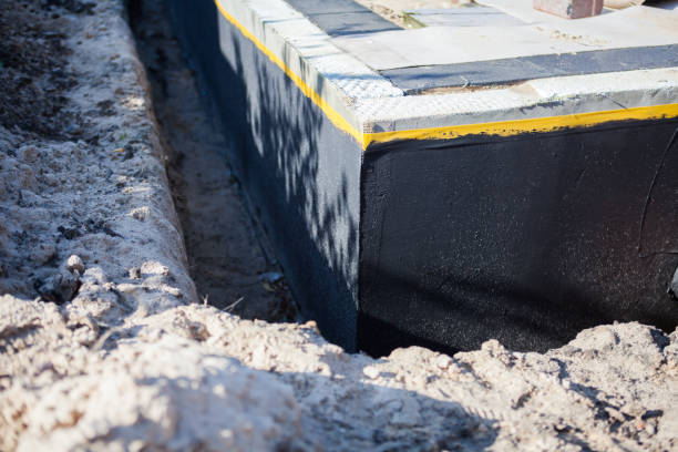 Professional Waterproofing technician working in Hillsboro, IN